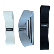 Three A90 Hip Bands of varying resistance levels displayed against a black background, ideal for hip movement workout exercises.